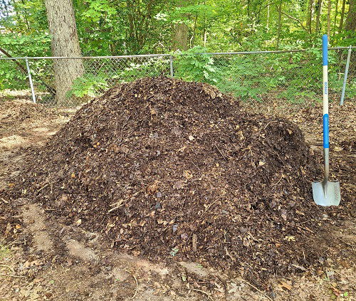 compost with fallen leaves in garden